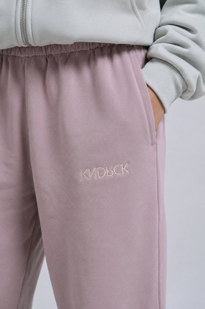 KNDRCK blush hlače z zadrgo