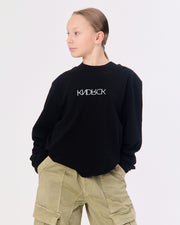KNDRCK majica z dolgimi rokavi - črna